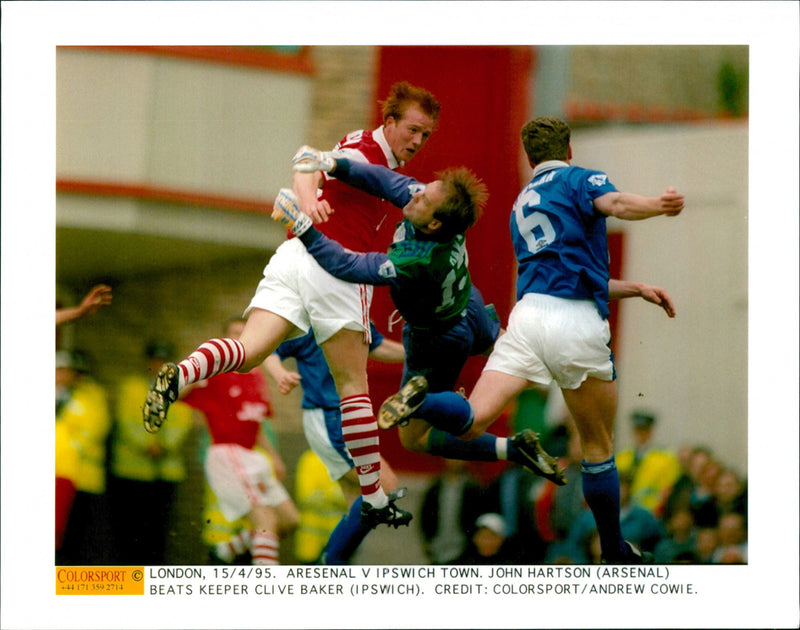 Arsenal - Ipswich Town. John Hartson (Arsenal) beats goalkeeper Clive Baker (Ipswich) - Vintage Photograph