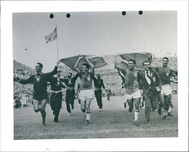 Soccer World Championship. Sweden - Brazil. The Brazilian team runs with the Swedish flag - Vintage Photograph