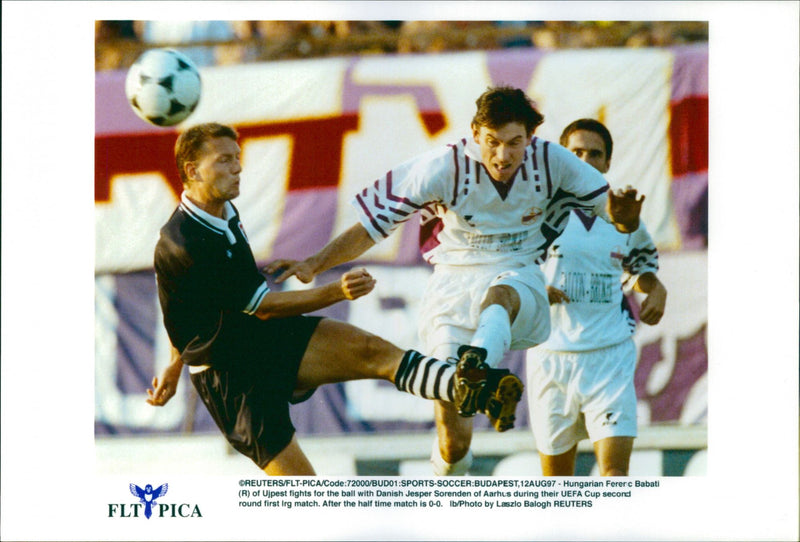 Hungarian Babati battles the ball with Denmark's Jesper Sørensen in the UEFA Cup - Vintage Photograph