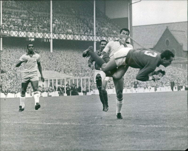 Soccer World Cup 1966. Portugal vs Brazil. Portugal goalkeeper Jose Pereira flies through the air - Vintage Photograph