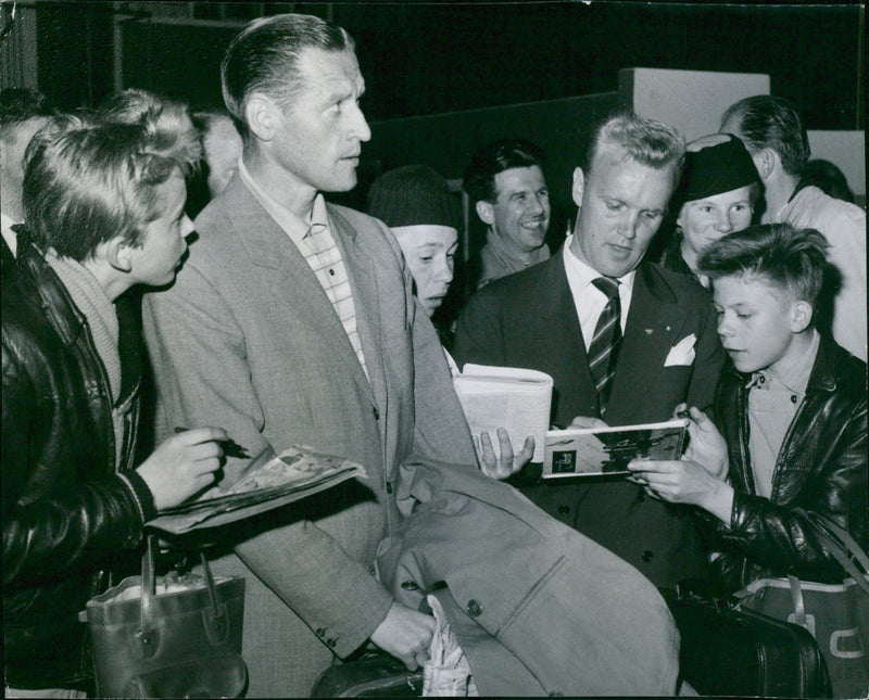 Nisse Liedholm and Nacka Skoglund surrounded by autograph hunters on arrival in Bromma - Vintage Photograph