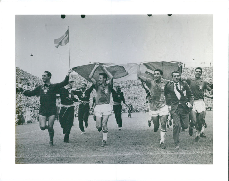 Sweden-Brazil. The Brazilian team runs with the Swedish flag - Vintage Photograph