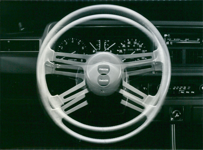 Mazda 323
Steering Wheel - Vintage Photograph