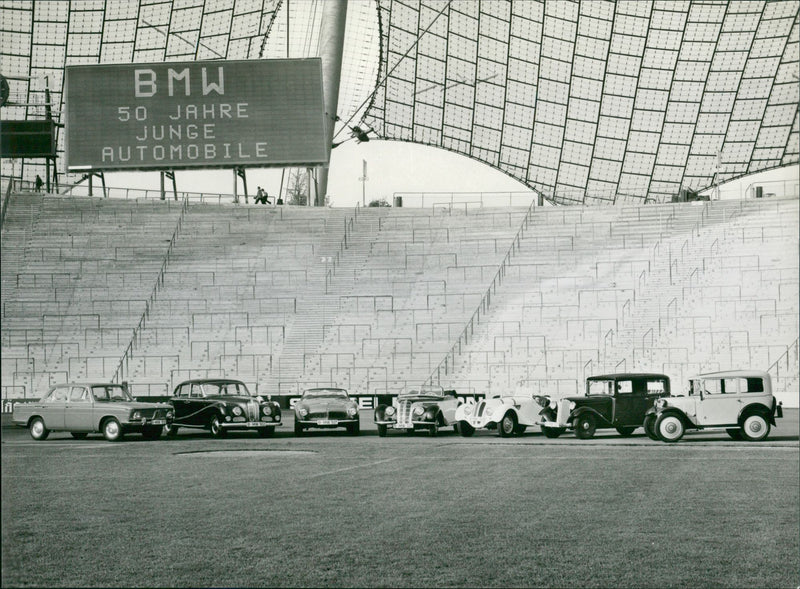 (R to L) 1929 BMW 3/15 Dixi,  1933 BMW 303, 1936 BMW 328 Sport, 1937 BMW 327/328 Cabriolet, 1956 BMW 507, 1954 BMW 502,  1962 BMW 1500 - Vintage Photograph