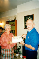 Old Couple holding a cake - Vintage Photograph