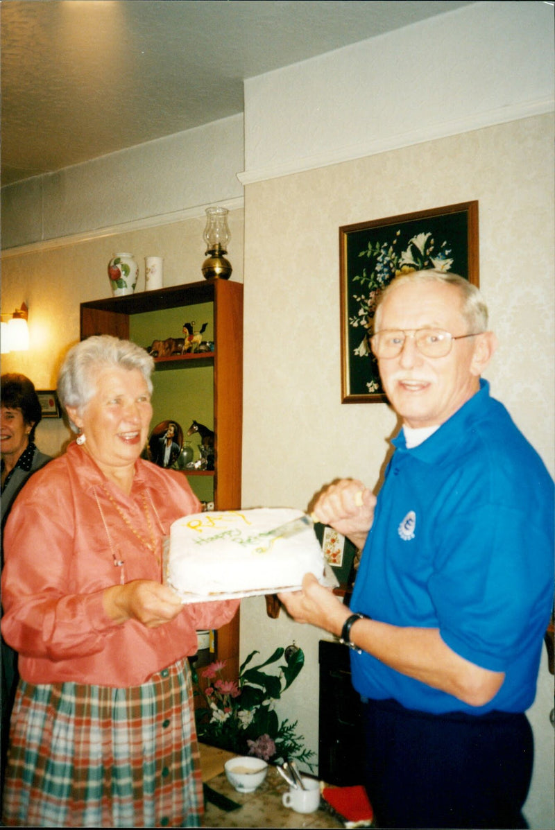 Old Couple holding a cake - Vintage Photograph