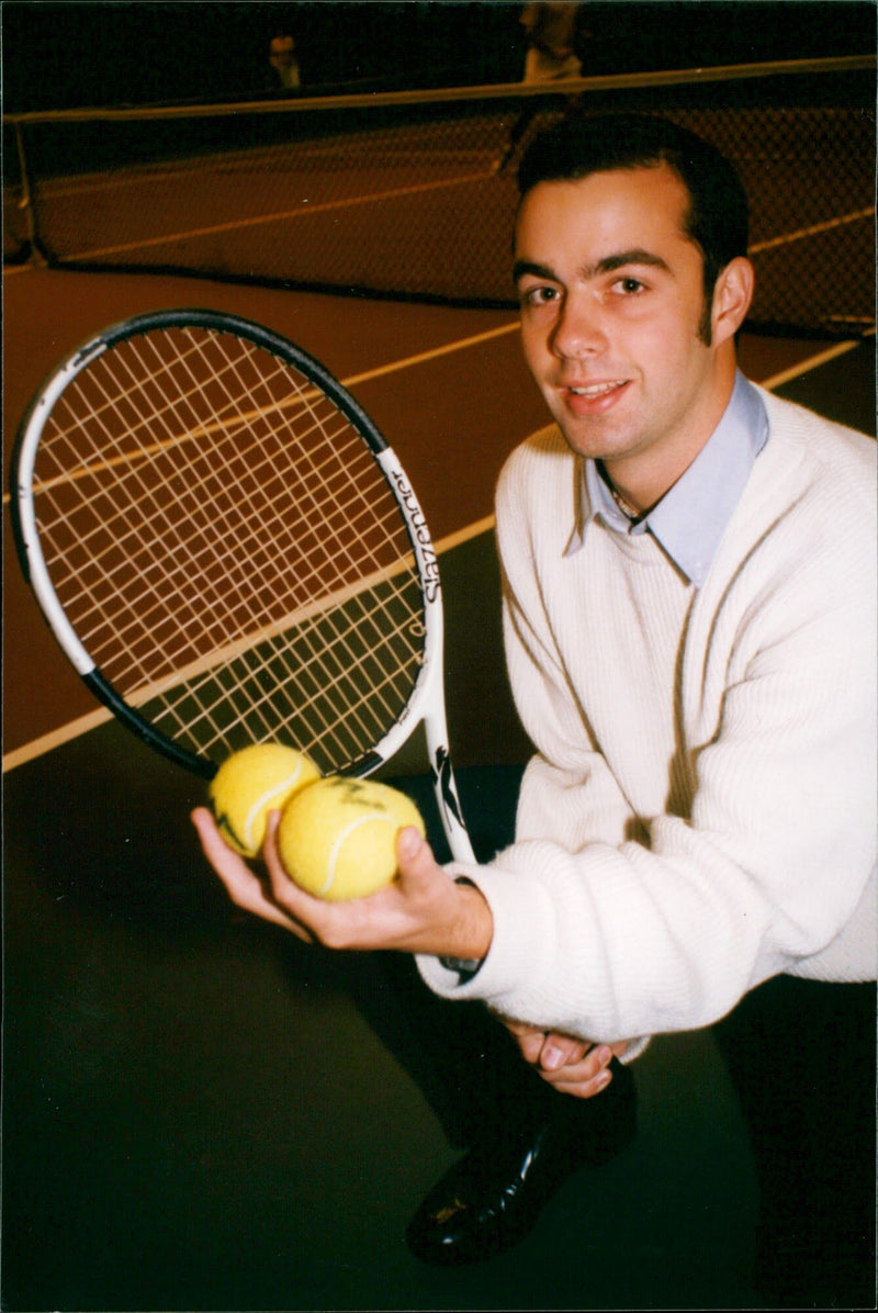 Man holding a tennis racket - Vintage Photograph