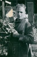 Market vendor selling his produce - Vintage Photograph