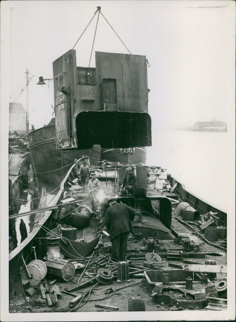 Trawlers in demolition hands - Vintage Photograph