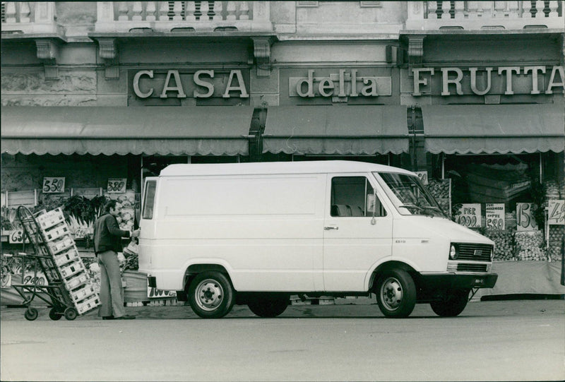 A fiat van is being loaded with vegetables. - Vintage Photograph