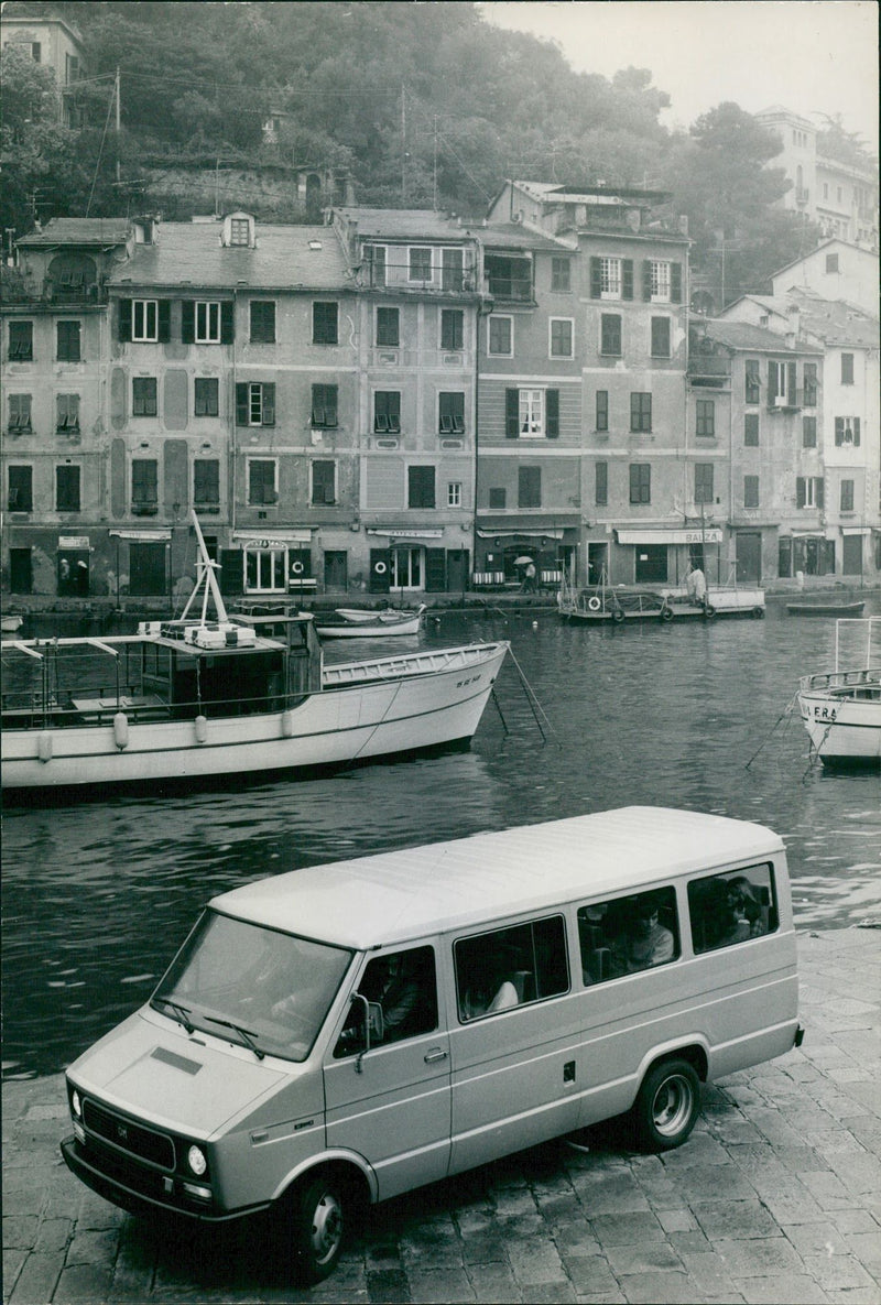 A Fiat minibus is driving alongside the river - Vintage Photograph