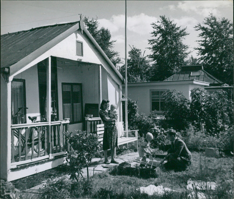 Family playing in the front yard - Vintage Photograph
