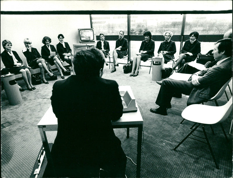 Flight attendants during a closing briefing - Vintage Photograph