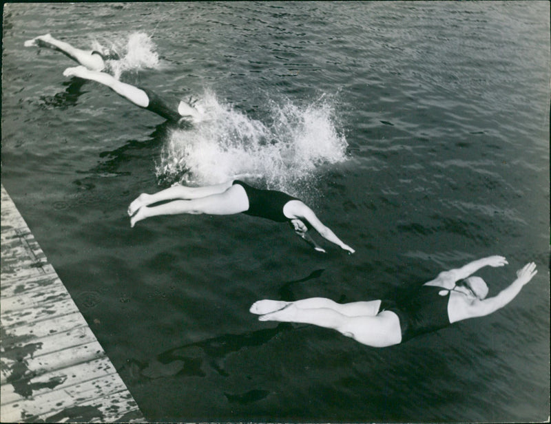 Swimmers take a dive - Vintage Photograph