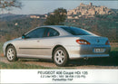 2001 Peugeot 406 Coupe HDi 135, side and rear view - Vintage Photograph
