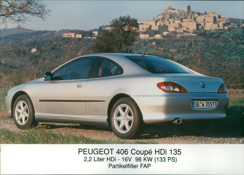 2001 Peugeot 406 Coupe HDi 135, side and rear view - Vintage Photograph