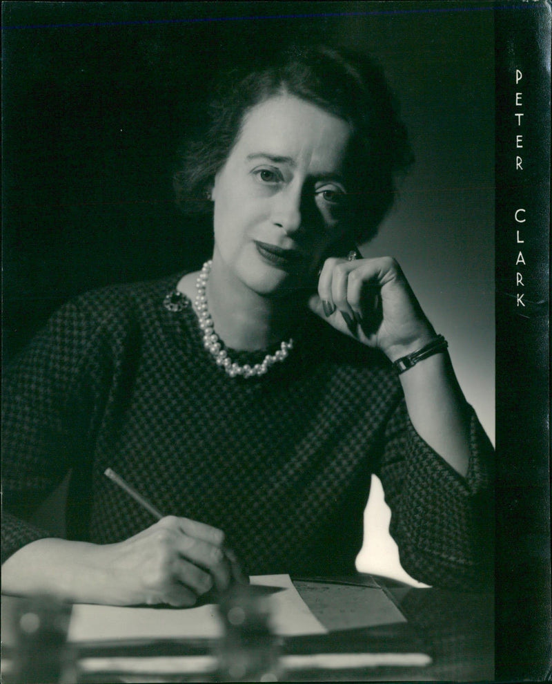 Thoughtful lady writing in her carnet - Vintage Photograph