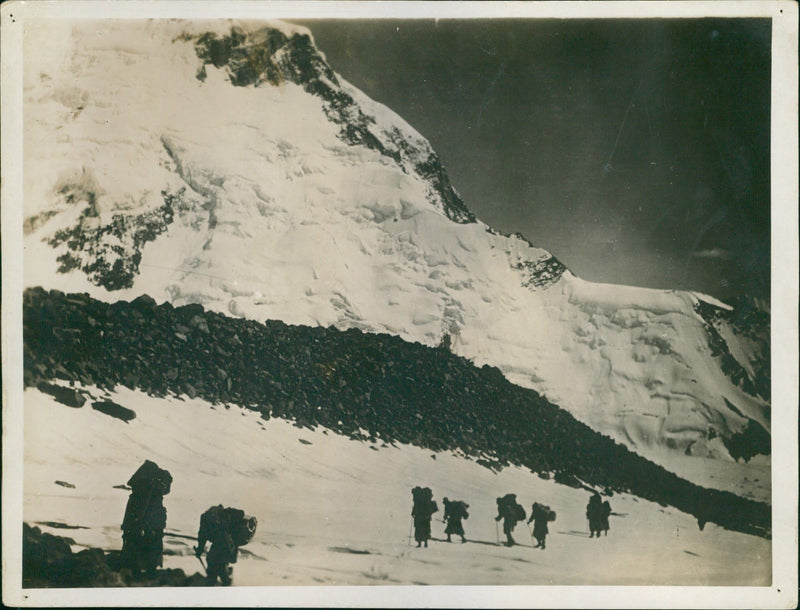 Mountaineers climbing in snowy mountains - Vintage Photograph