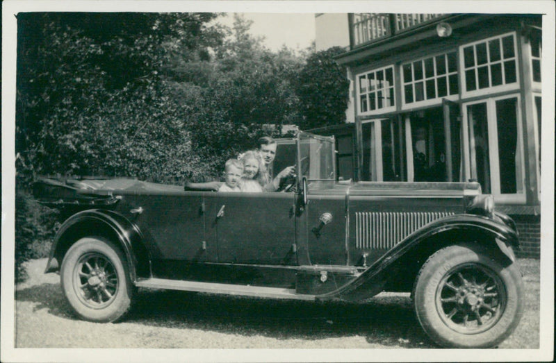 Uncle and cousins in the fast wagon - Vintage Photograph