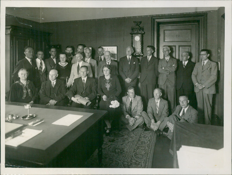 Group of men and women posing in an office - Vintage Photograph