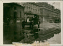 Vintage car driving on a wet road - Vintage Photograph