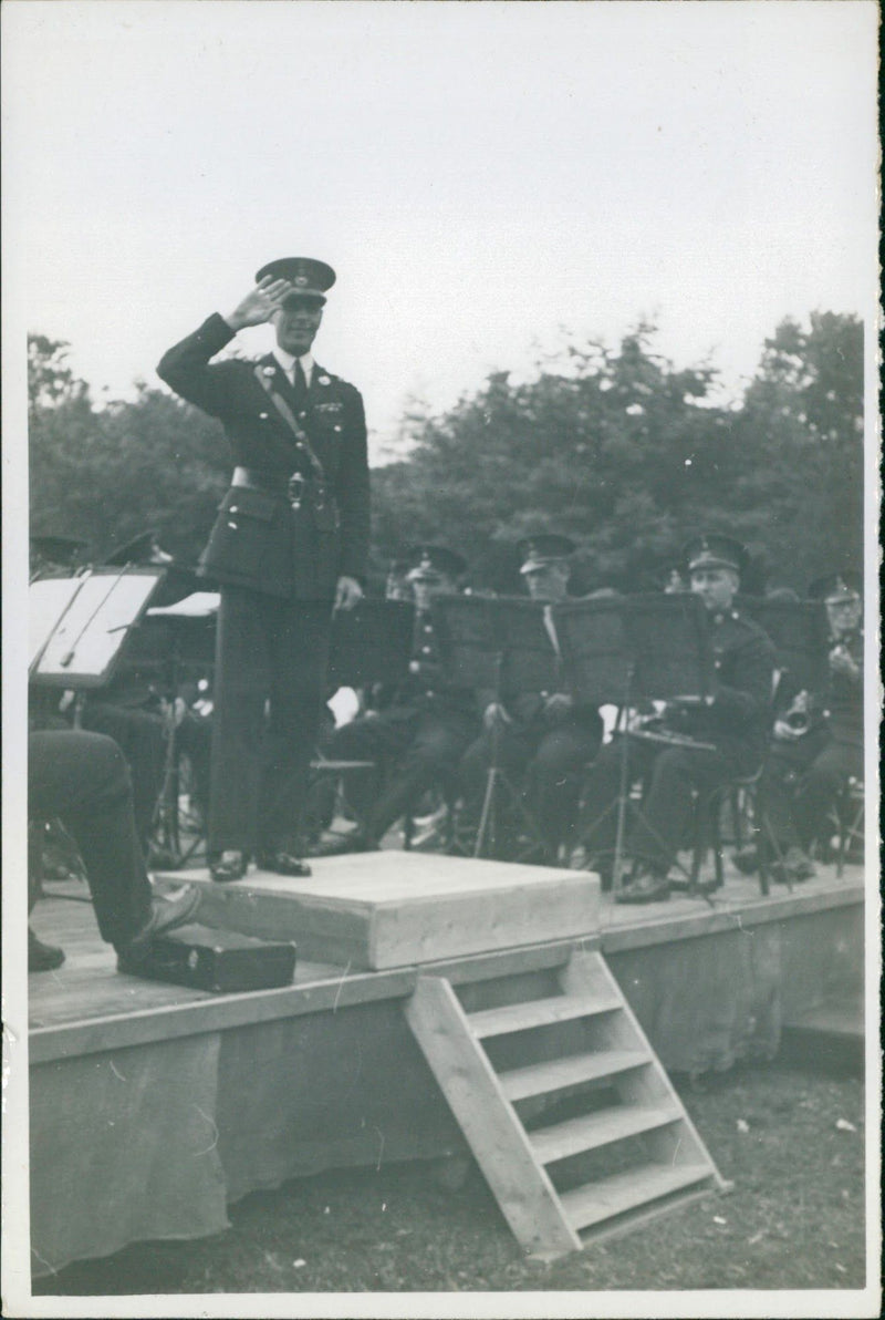 An army officer saluting on a podium - Vintage Photograph