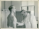 Medical examination of a soldier by a military doctor - Vintage Photograph