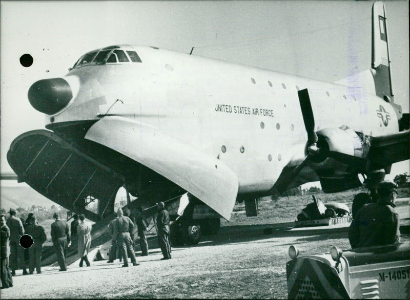 Globemaster Unloads Military Equipment - Vintage Photograph