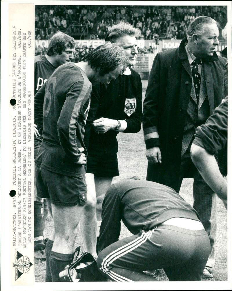 A bottle thrown on the field hit the referee - Vintage Photograph