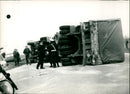 An overturned truck on National Road 4. - Vintage Photograph