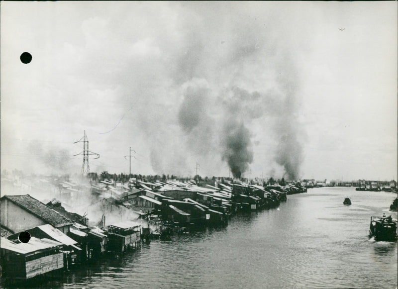 Fire after combat in Saigon. - Vintage Photograph