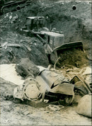 A bulldozer is clearing up mud - Vintage Photograph