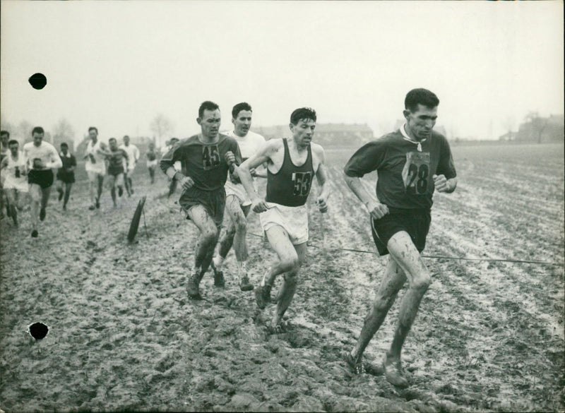 Rhadi is followed by Marcel Vandewattyne during a cross race - Vintage Photograph