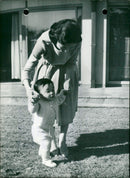 Princess Michiko is teaching Prince Hiro to walk - Vintage Photograph