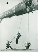 US Marines disembarking a helicopter - Vintage Photograph