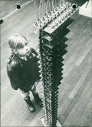 A girl in front of a music making machine - Vintage Photograph