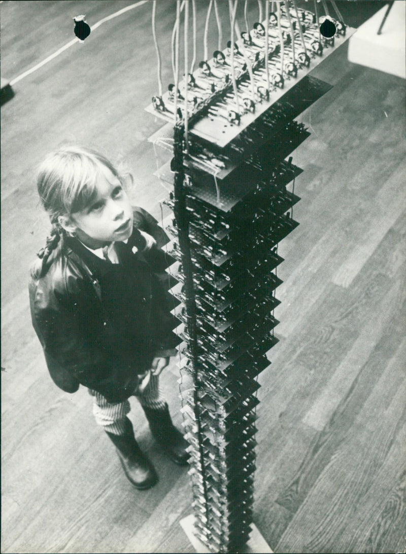 A girl in front of a music making machine - Vintage Photograph