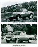 1997 Nissan 4x4 XE truck and 1997 Nissan 4x2 XE truck - Vintage Photograph