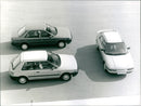 1989 Mazda 323 Sedan and 1989 Mazda 323 Hatchback - Vintage Photograph