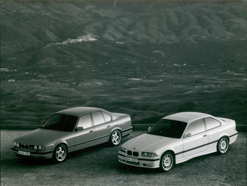 1994 BMW M3 Coupe and 1994 BMW M5 - Vintage Photograph