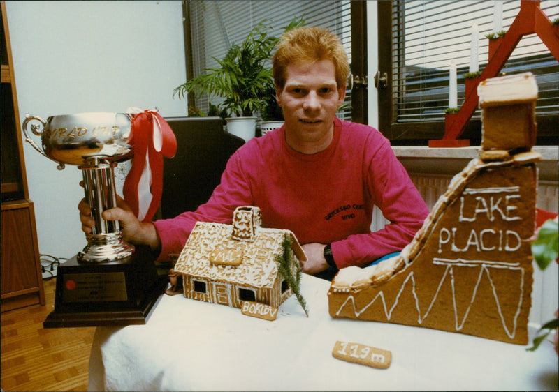 Jan Boklöv in his home with a gingerbread jumping hill made by his wife Jorun - Vintage Photograph