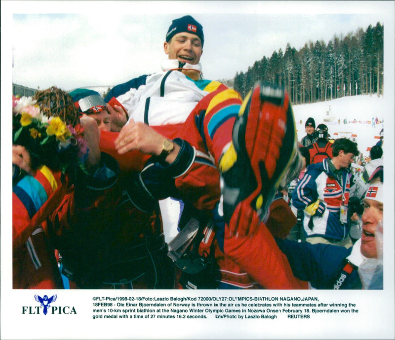 Ole Einar Bjørndalen is celebrated by his teammates after winning Olympic gold in the 10 km sprint in Nagano - Vintage Photograph