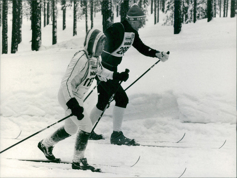 Internationally in the Vasaloppet track. Thai "Kajsa" Boormonthira passes a male competitor - Vintage Photograph