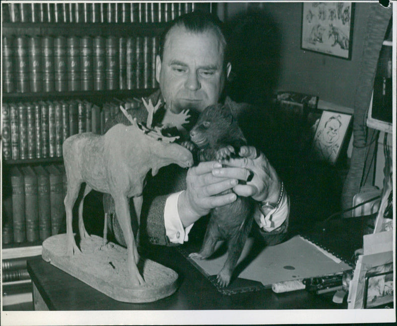 Animal keeper Harald Hedblom with the new bear cub at Skansen - Vintage Photograph