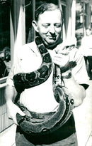 Zookeeper with a snake - Vintage Photograph