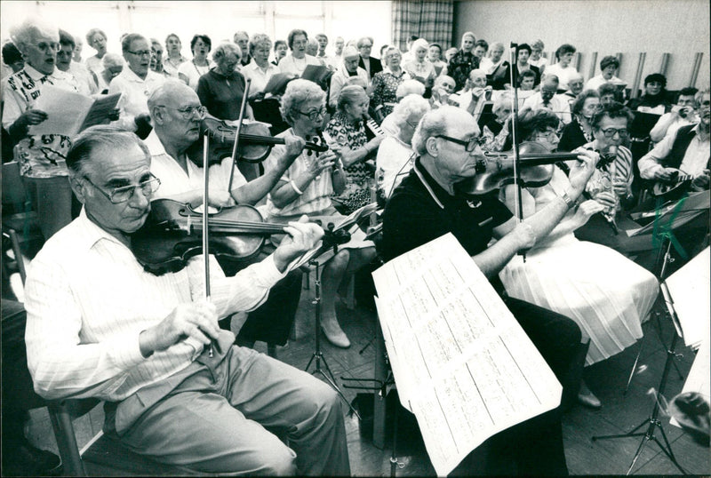 The musicians rows with their central stands. Up to 85 older ladies and gentlemen pack their instruments every Monday in the Social Center Marbachweg. With them samples u - Vintage Photograph