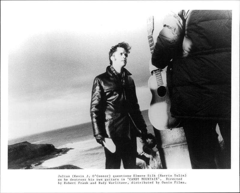 Actor Kevin J. O'Connor and Harris Yulin in a scene from the 1987 film "Candy Mountain". - Vintage Photograph