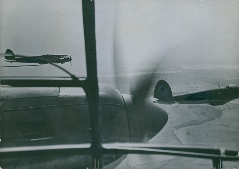 War planes fly in the skies. - Vintage Photograph