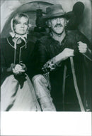 James Arness and Eva Marie Saint star in the 1976 western film, "The Macahans," on German TV on January 6, 1996. - Vintage Photograph
