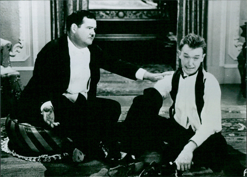 Oliver Hardy and Stan Laurel - Putting Pants on Philip - Vintage Photograph